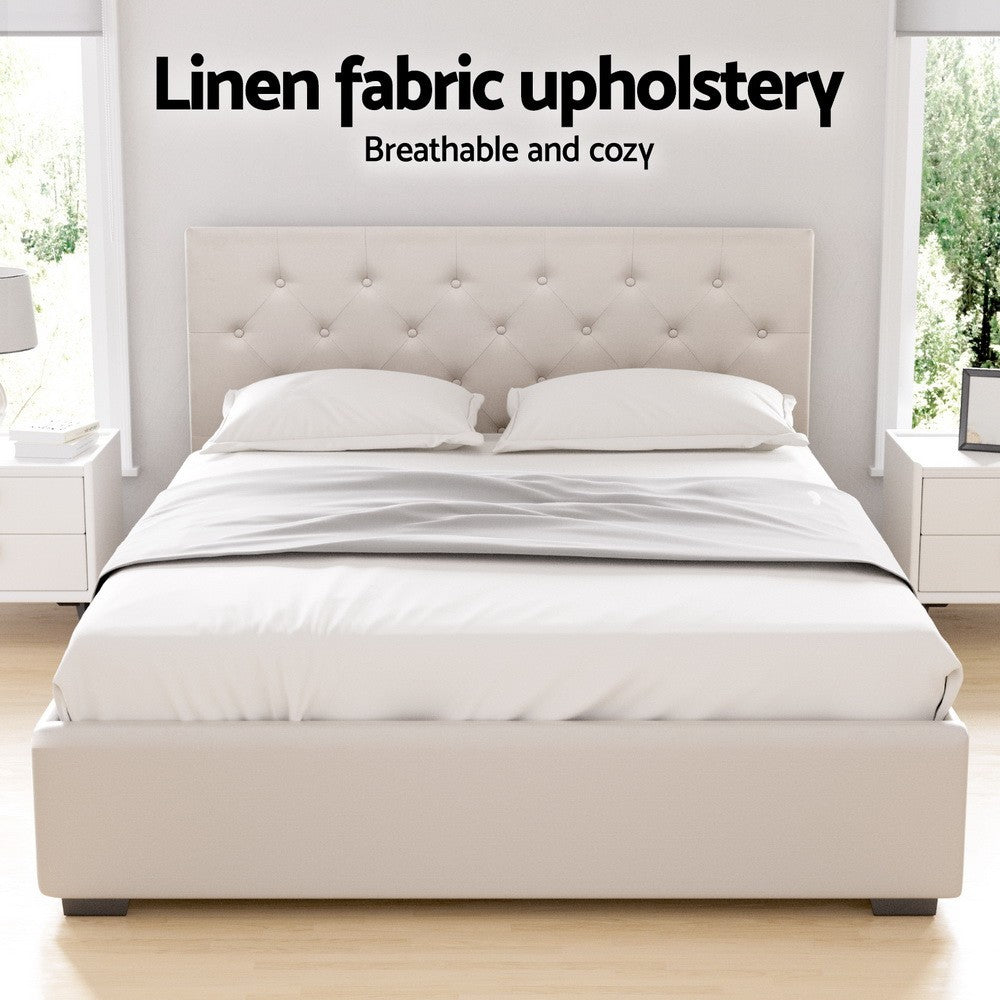 Beige upholstered bed with linen fabric in a bright bedroom setting