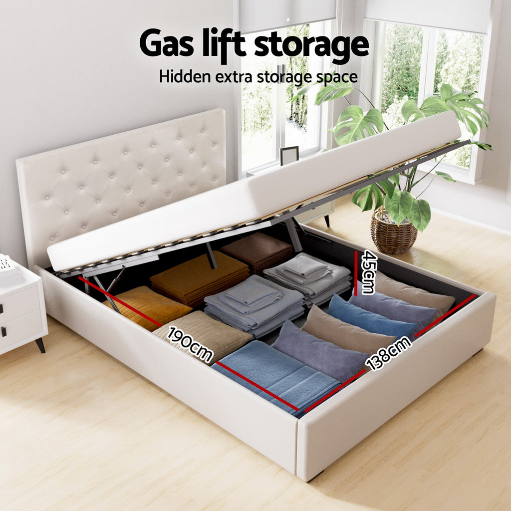 White bed with gas lift storage feature open, showing hidden extra storage space.